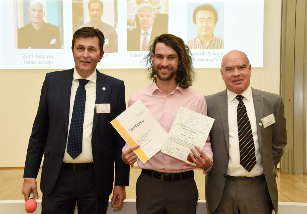GENCO Young Scientist Prize Winner Guy Leckenby (center) with the GENCO President Christoph Scheidenberger and Vice-President Zsolt Podolyak