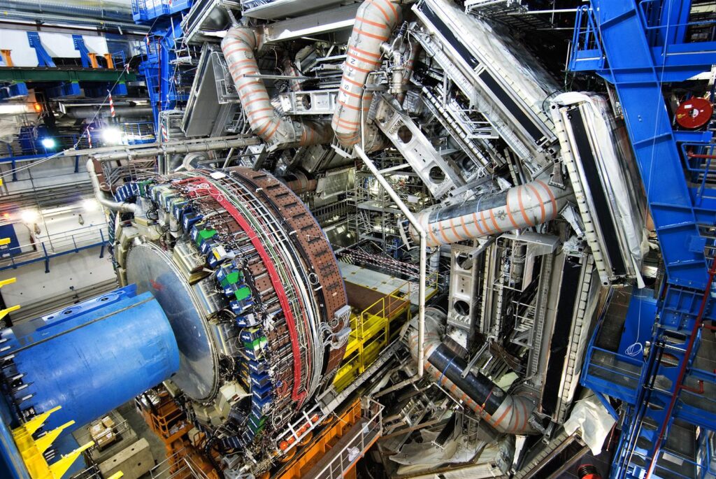 One of the end-cap calorimeters for the ATLAS experiment is moved using a set of rails. This calorimeter will measure the energy of particles that are produced close to the axis of the beam when two protons collide. It is kept cool inside a cryostat to allow the detector to work at maximum efficiency.