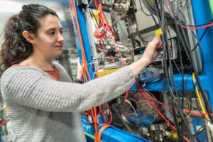 former TRIUMF PhD student Marilena Lykiardopoulou working at the TITAN facility